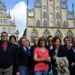 High-Level-Group zu Besuch in Münster: Ein Gruppenbild vor dem schönen alten Rathaus in Münster.
