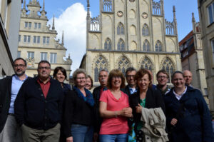 High-Level-Group zu Besuch in Münster: Ein Gruppenbild vor dem schönen alten Rathaus in Münster.